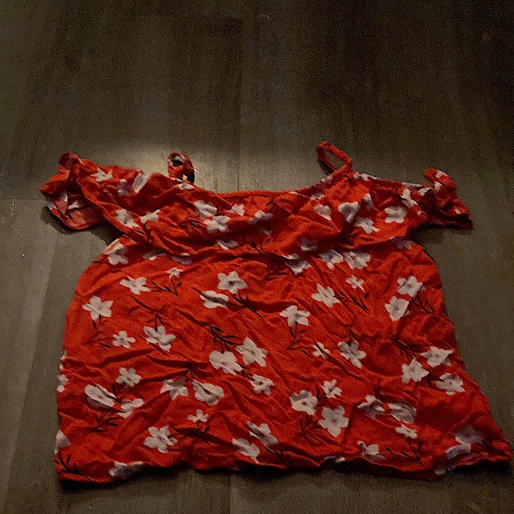 Red flower tank top with ruffles at the top. Thin strapped. Kids size large
